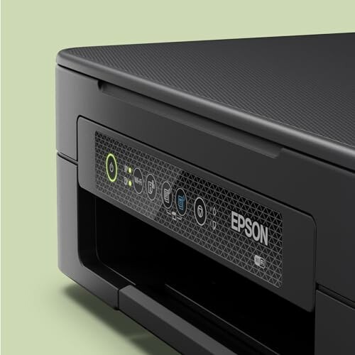 Side view of Epson printer on green background